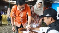PJ Walikota Pagar Alam Nelson Firdaus Gunakan Hak Pilihnya Di TPS 15 Dempo Makmur