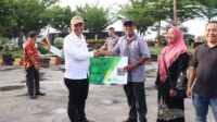Pjs. Wali Kota Gunungsitoli Salurkan Kartu BPJS Ketenagakerjaan